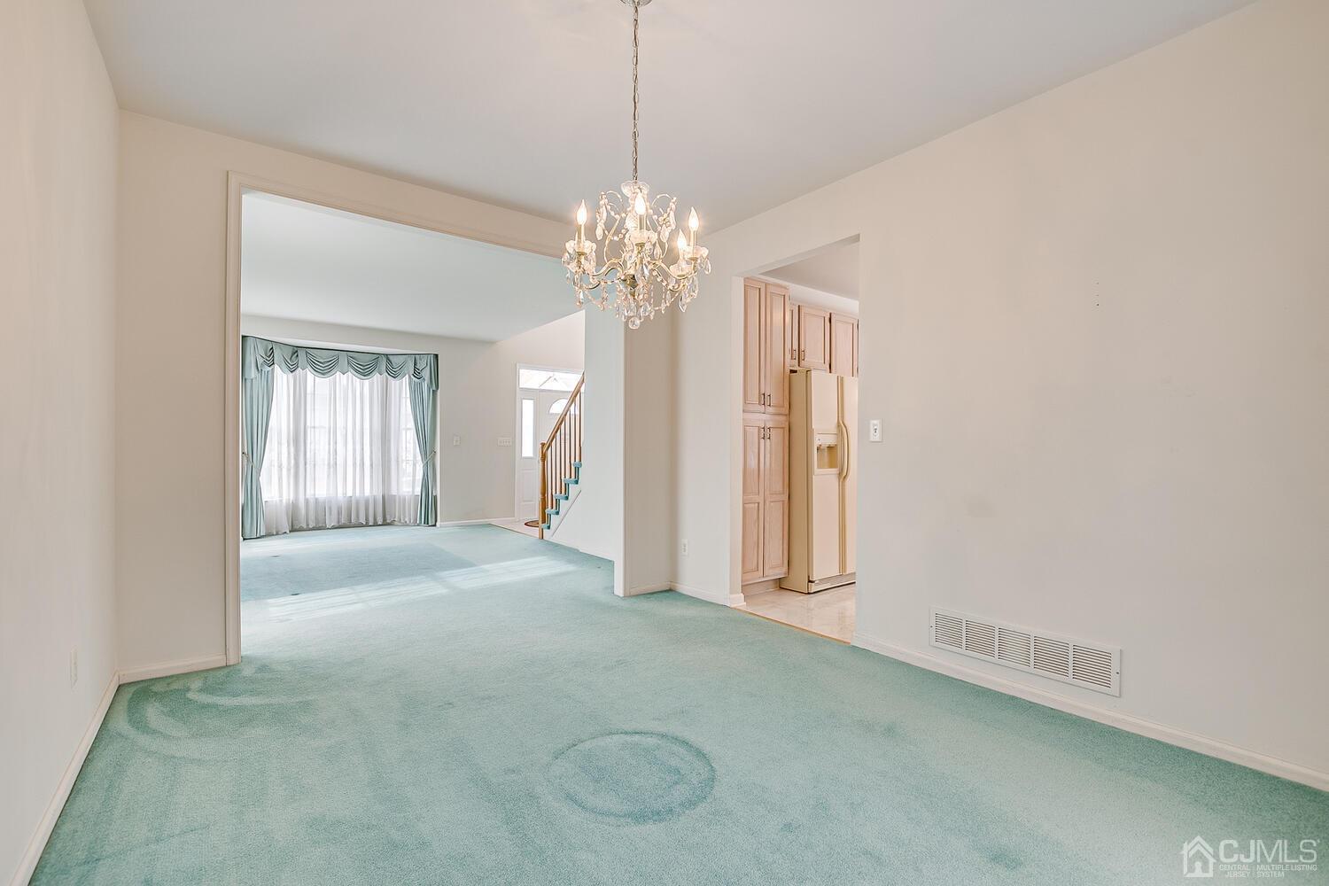 22 Timber Ridge Road North Brunswick, NJ 08902 - Photo 10 of 50 a view of a big room with windows and chandelier