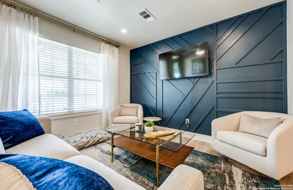a living room with furniture and a window