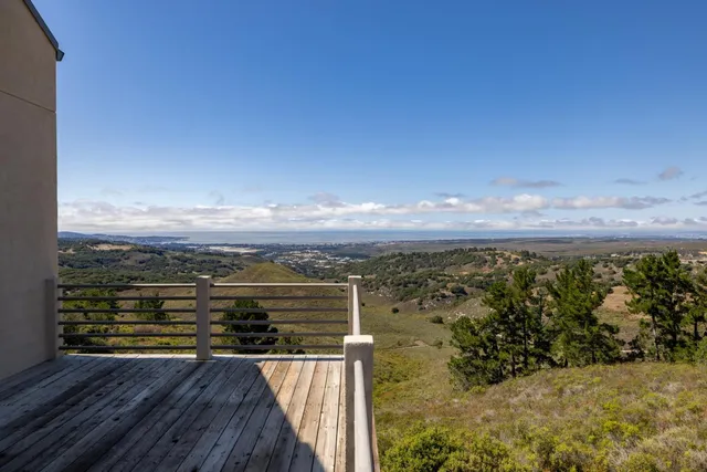 a view of a balcony with ocean view