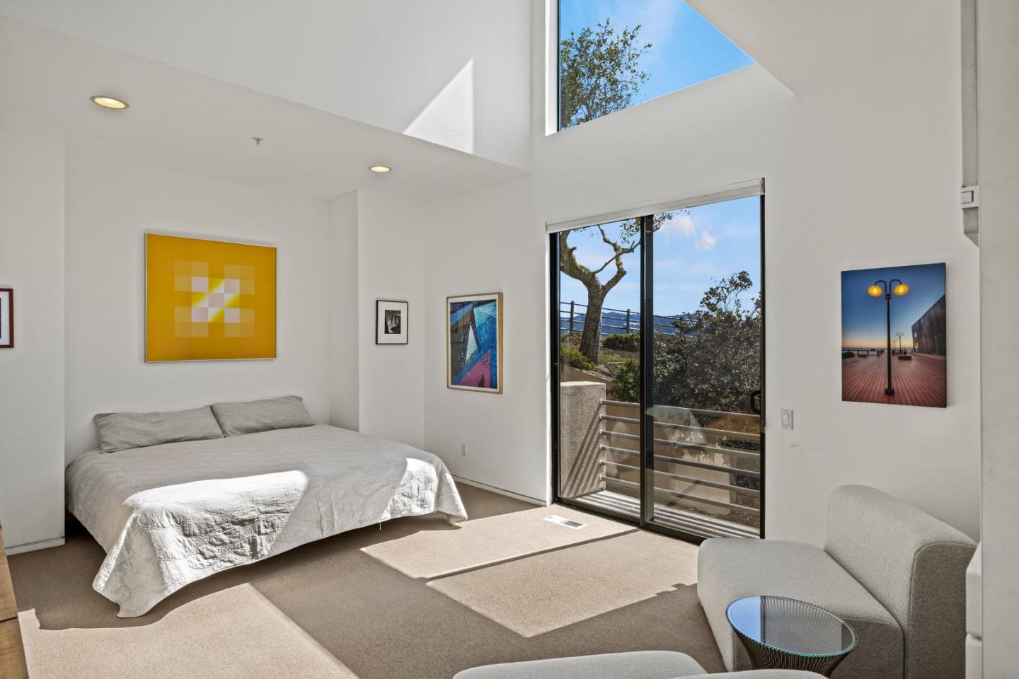 10450 Saddle Road Monterey, CA 93940 - Photo 36 of 49 a bedroom with a bed and glass window