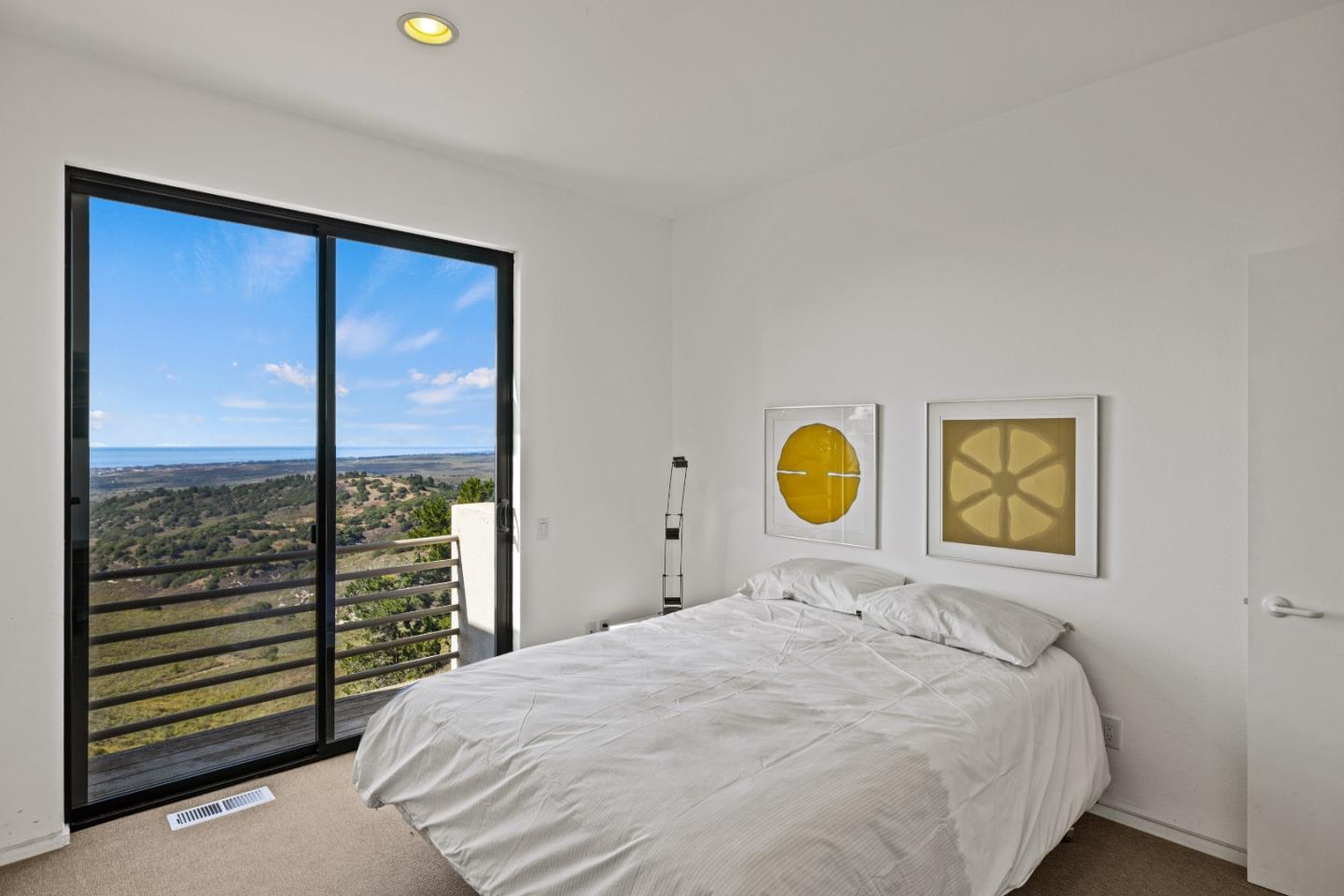 10450 Saddle Road Monterey, CA 93940 - Photo 40 of 49 a bedroom with a bed and a painting on the wall