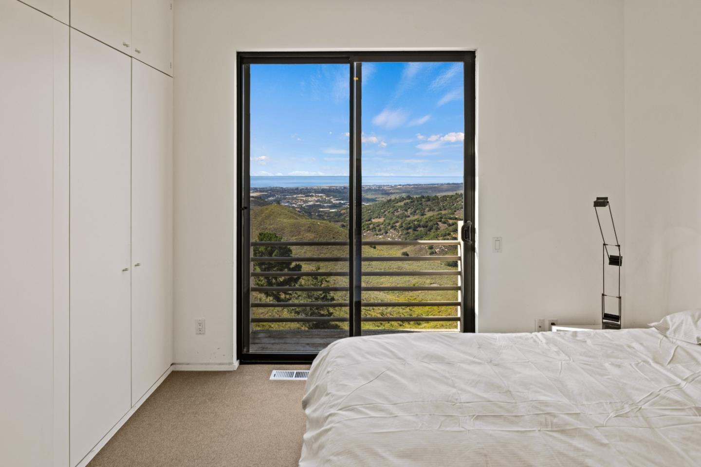 10450 Saddle Road Monterey, CA 93940 - Photo 41 of 49 a bedroom with a bed and a table