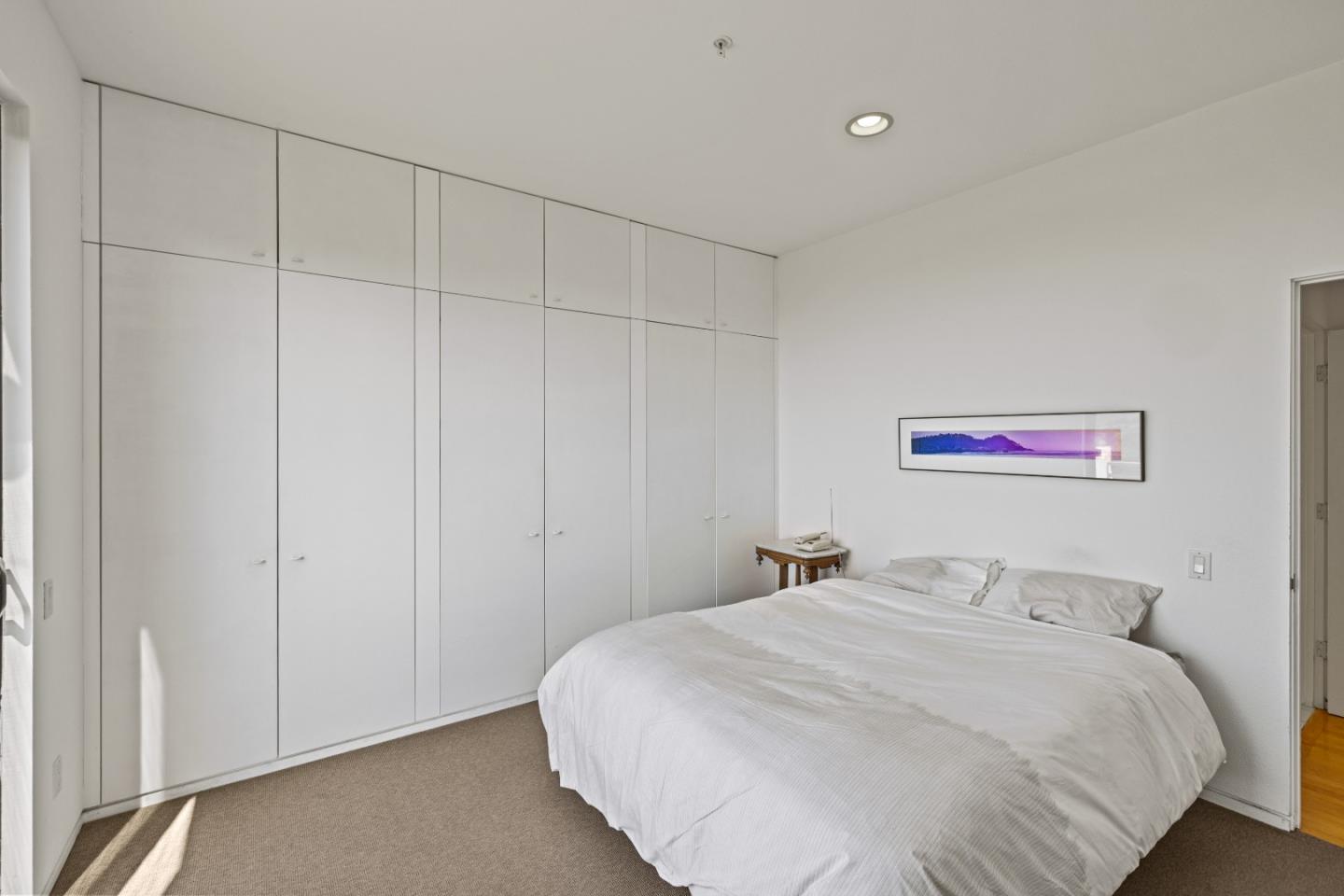 10450 Saddle Road Monterey, CA 93940 - Photo 42 of 49 a bedroom with a large bed and a shower