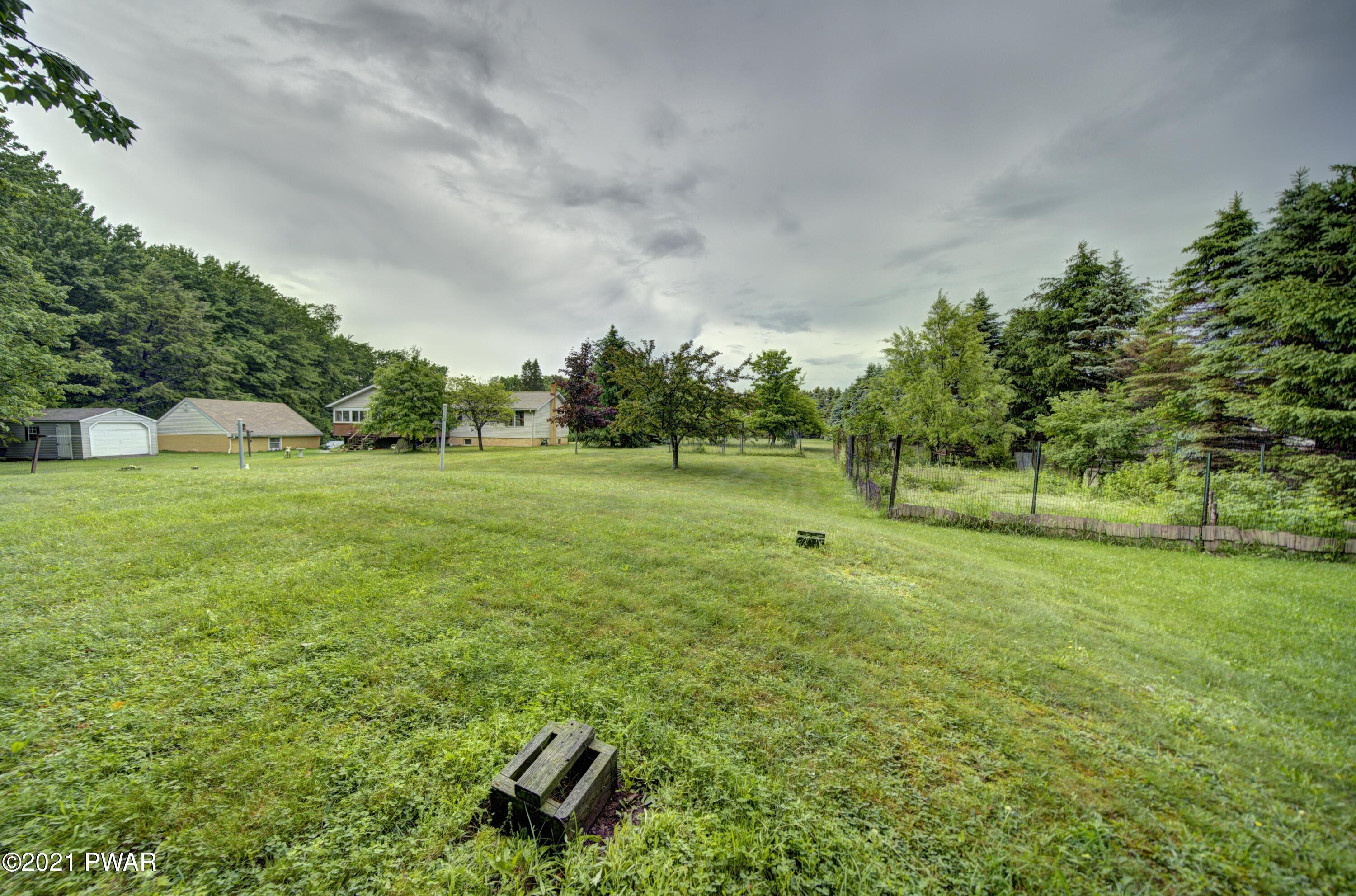 368 Roemerville Road Greentown, PA 18426 - Photo 53 of 59 a big yard with lots of green space and trees