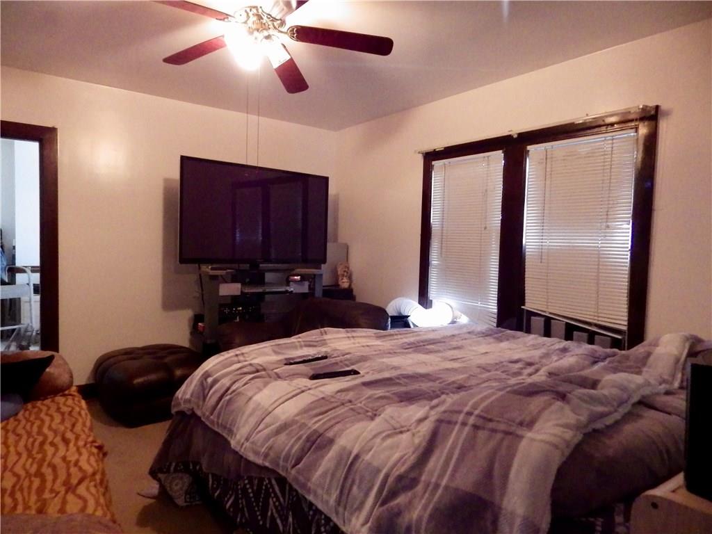 3076 Mt Troy Road Pittsburgh, PA 15212 - Photo 8 of 13 Large living room currently being used as master bedroom.