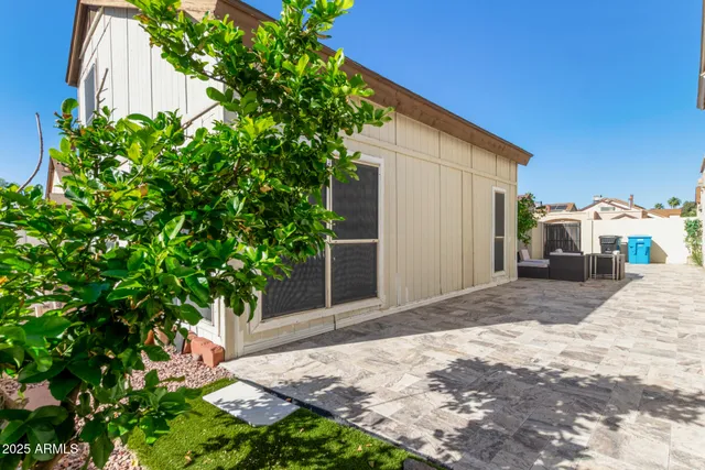a backyard of a house with seating space