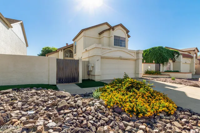 front view of a house with a yard
