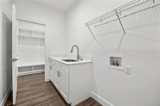 a bathroom with a sink and mirror