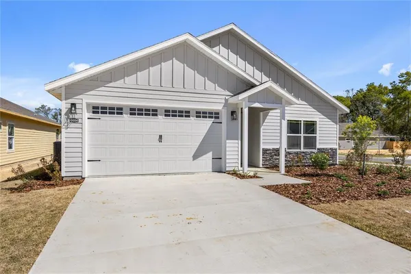 a front view of a house with a garage