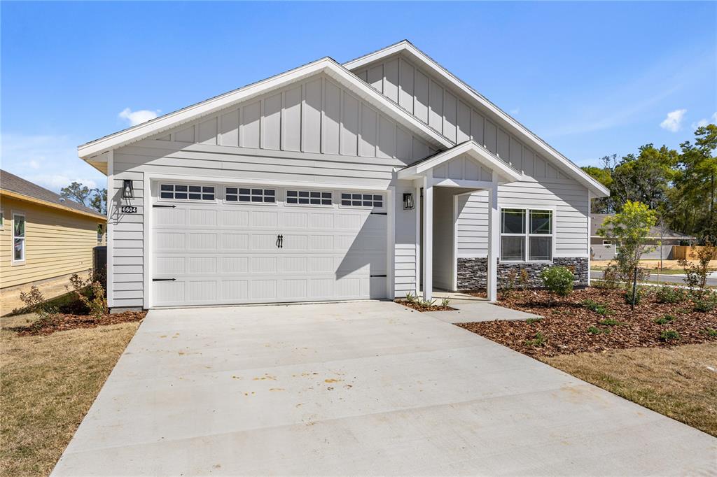 1132 Southwest 67th Drive Gainesville, FL 32607 - Photo 28 of 30 a front view of a house with a garage