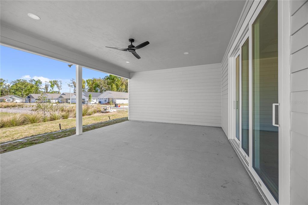 1132 Southwest 67th Drive Gainesville, FL 32607 - Photo 3 of 30 a view of a room with wooden floor and windows