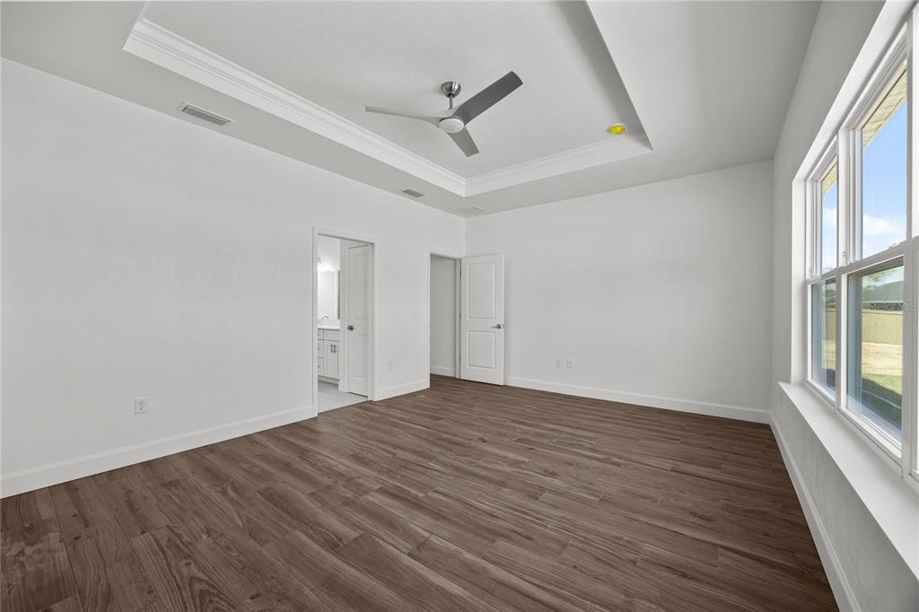 1132 Southwest 67th Drive Gainesville, FL 32607 - Photo 6 of 30 wooden floor in an empty room with a window