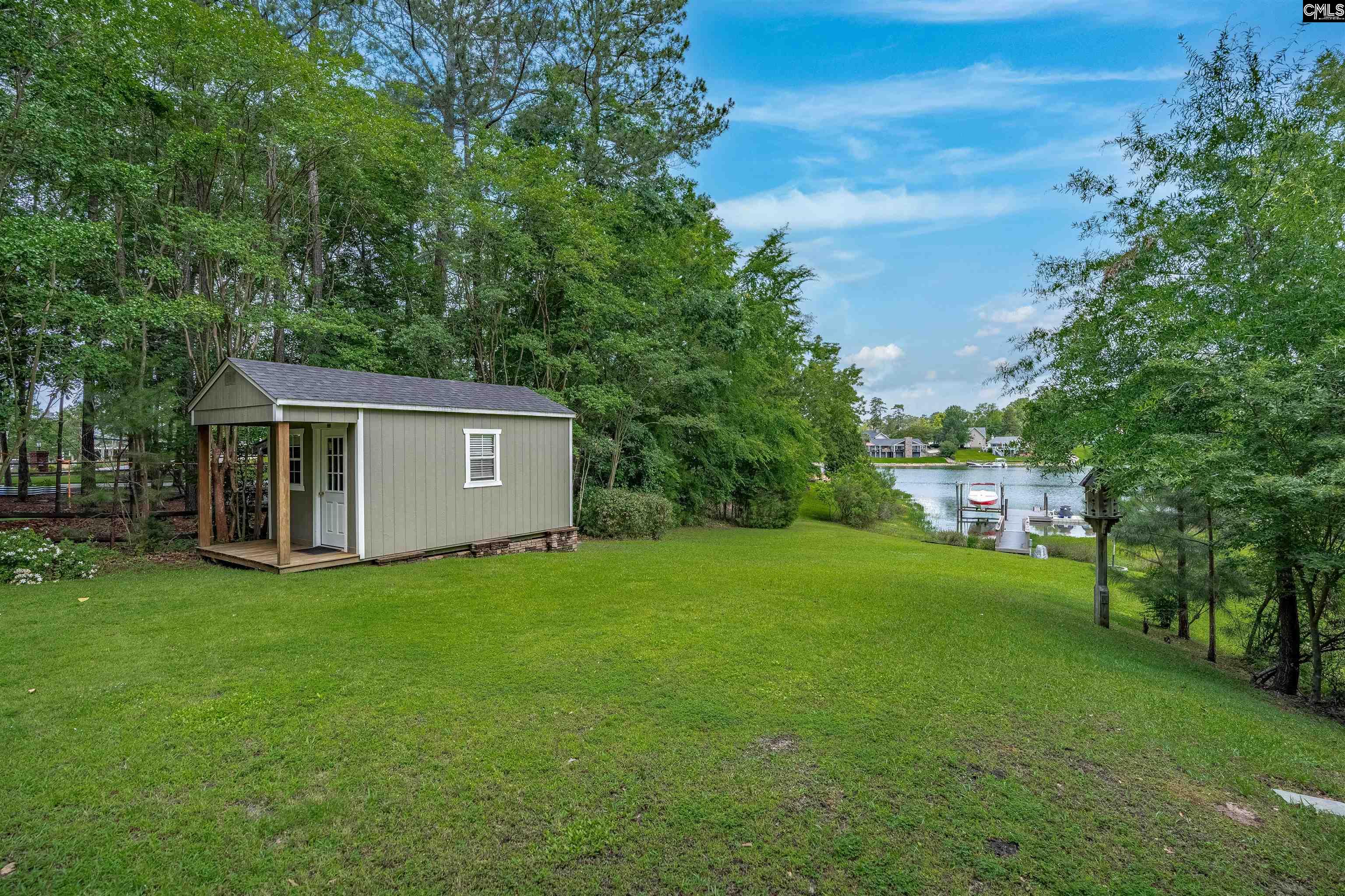 1101 Ellett Road Chapin, SC 29036 - Photo 20 of 24 a view of a house with backyard