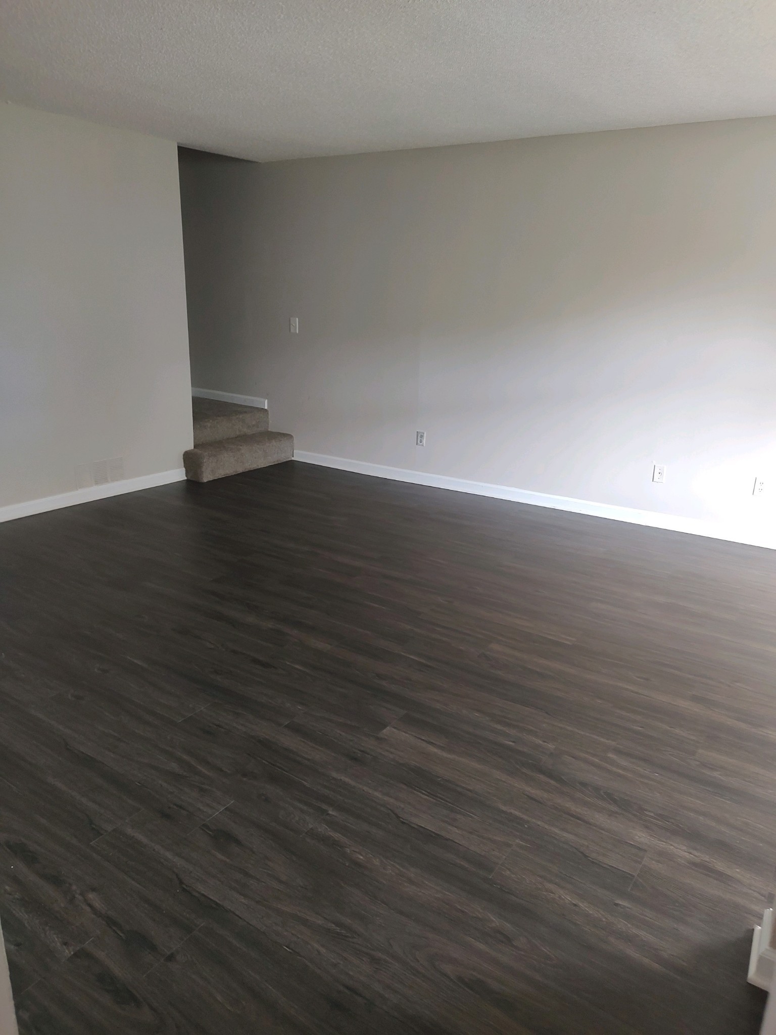 1301 Neelys Bend Road, Unit A2 Madison, TN 37115 - Photo 2 of 9 a view of an empty room with wooden floor
