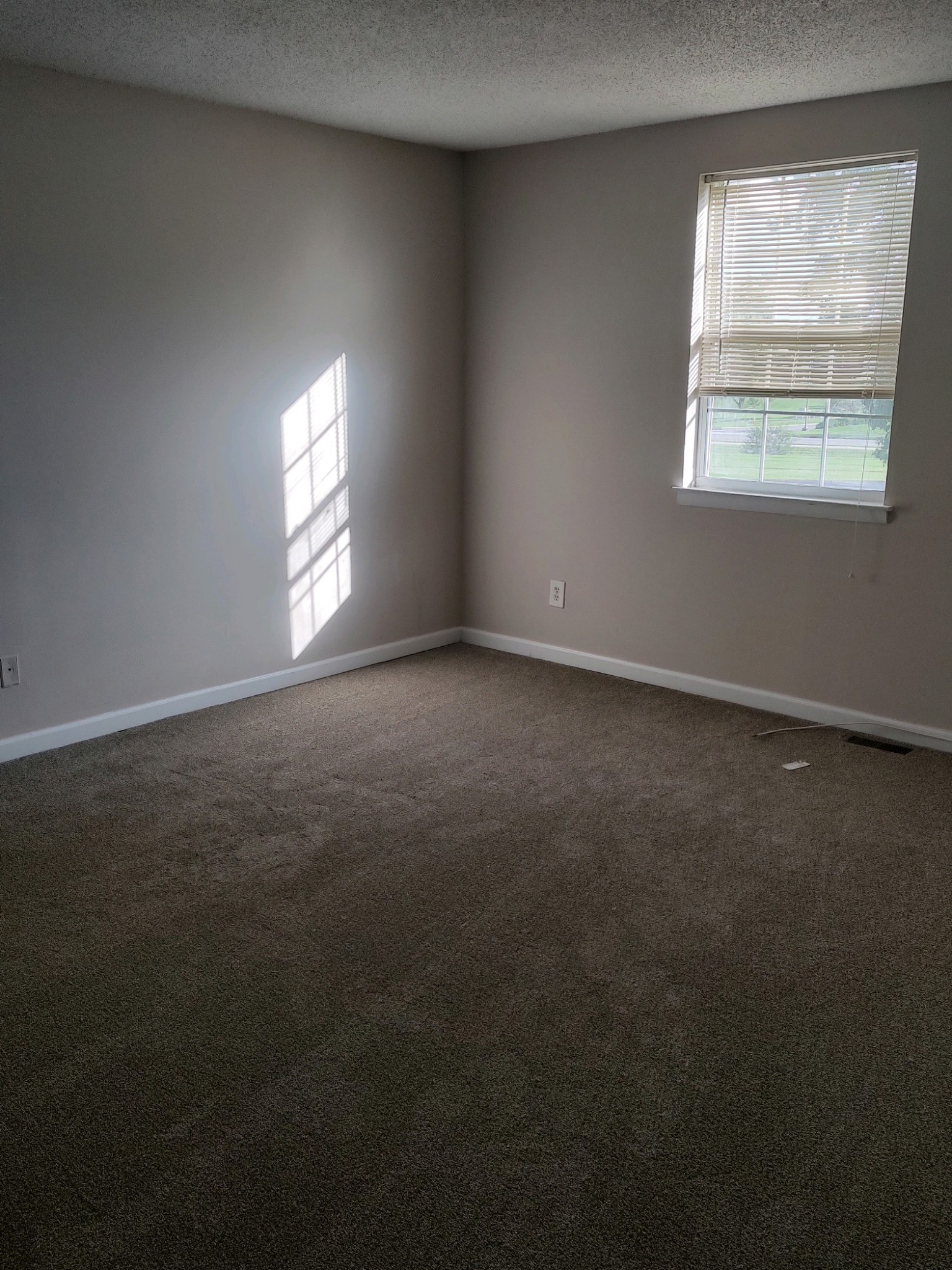 1301 Neelys Bend Road, Unit A2 Madison, TN 37115 - Photo 7 of 9 an empty room with a window