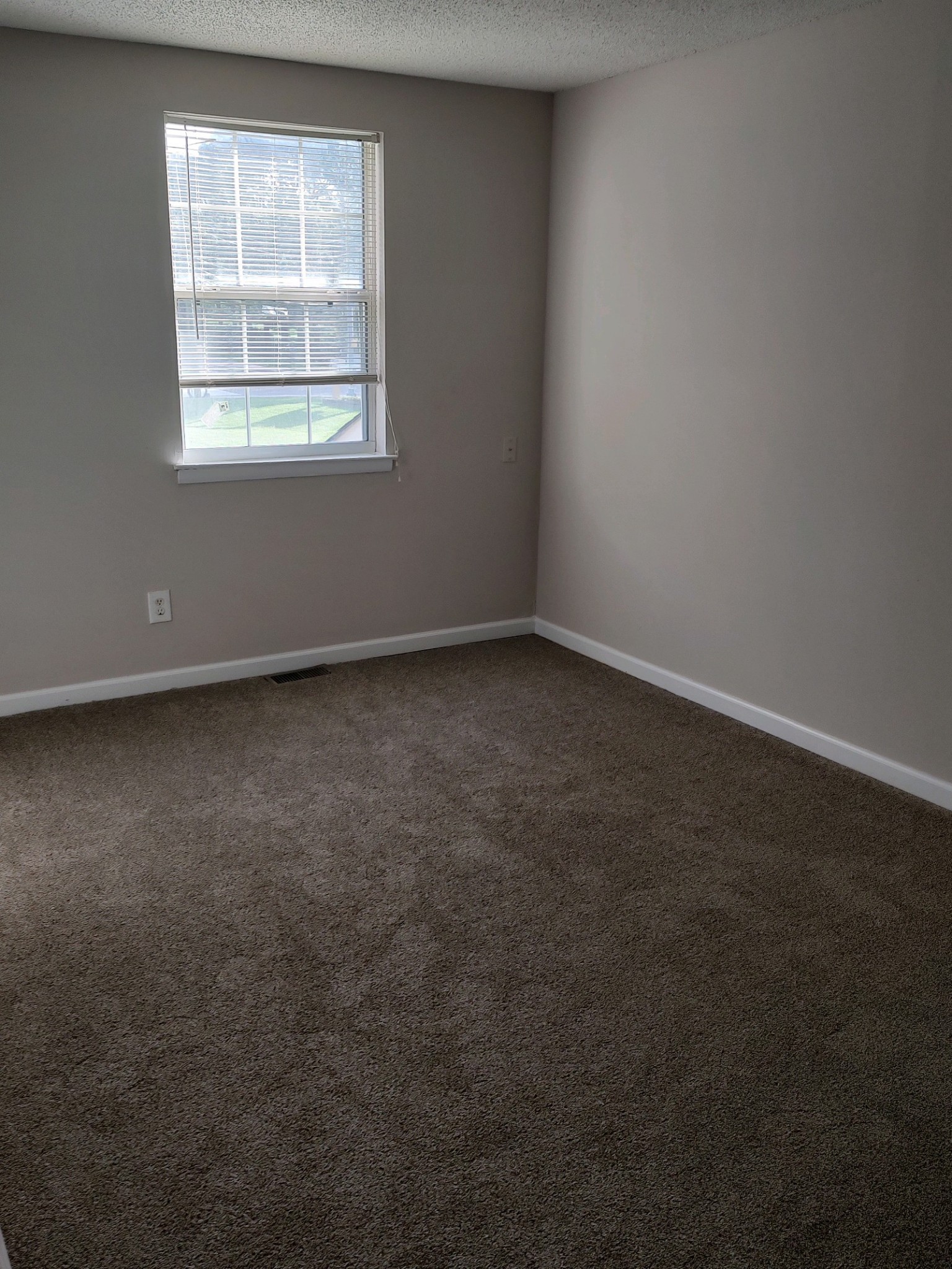 1301 Neelys Bend Road, Unit A2 Madison, TN 37115 - Photo 8 of 9 an empty room with a window
