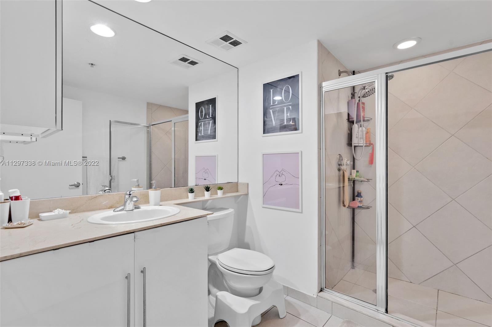 Downtown Miami Miami, FL 33131 - Photo 24 of 30 a bathroom with a sink toilet and shower