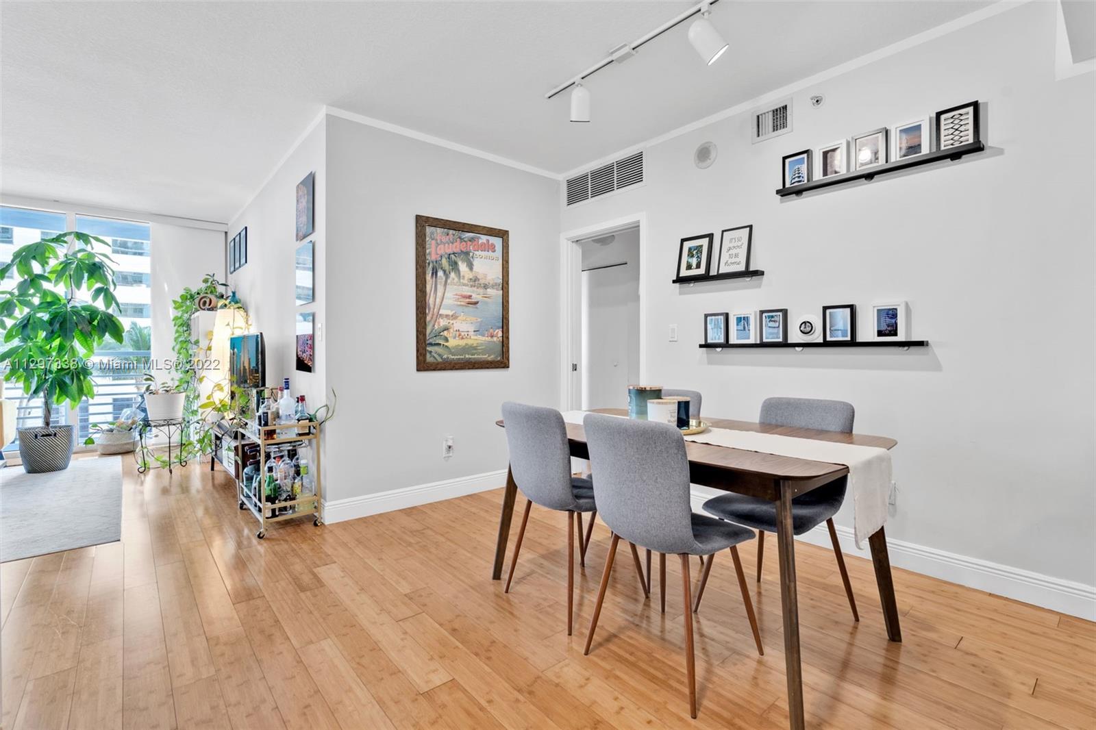 Downtown Miami Miami, FL 33131 - Photo 7 of 30 a view of a dining room with furniture and wooden floor