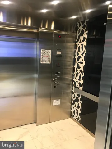 a kitchen with stainless steel appliances kitchen island sink and cabinets