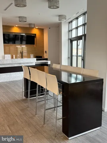 a kitchen with stainless steel appliances granite countertop a refrigerator a stove a sink and a microwave