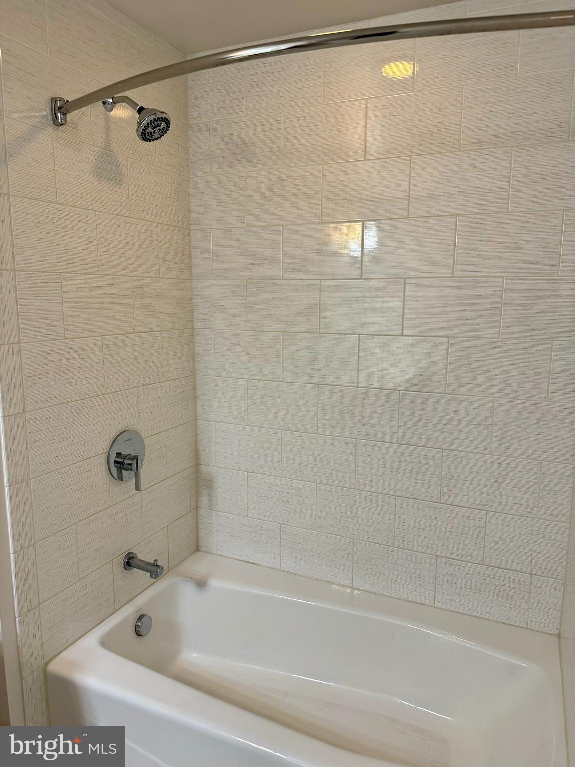 460 New York Avenue Northwest, Unit 407 Washington, DC 20001 - Photo 40 of 64 a bathroom with a shower and a bath tub