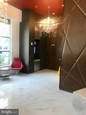 a bathroom with a mirror and a shower