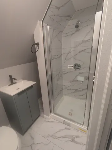 a bathroom with a sink and mirror