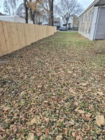a view of a backyard of the house