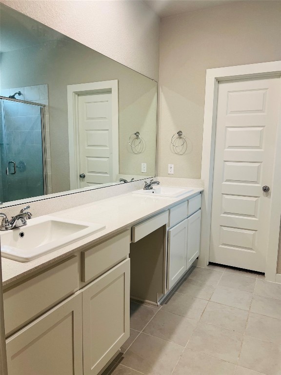 160 Coppers Way Elgin, TX 78621 - Photo 2 of 4 a bathroom with a sink and a mirror