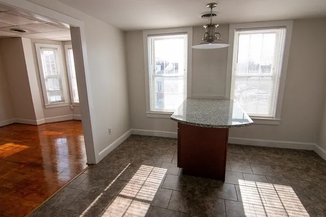 a bathroom with a bathtub and a window