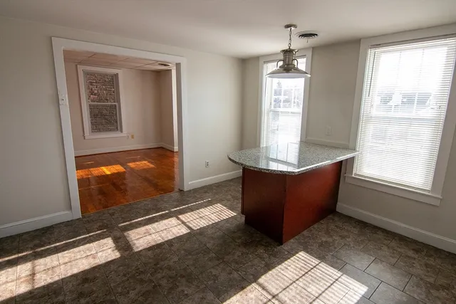 a living room with couch and window
