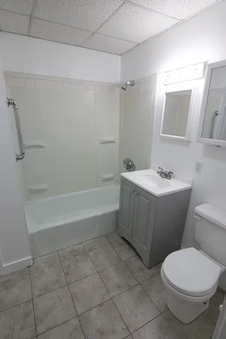 a bathroom with a bathtub sink and toilet