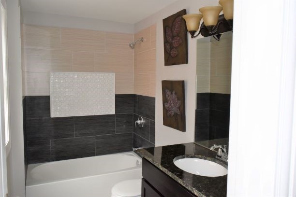 9405 South Laflin Street Chicago, IL 60620 - Photo 13 of 24 a bathroom with a sink and a mirror
