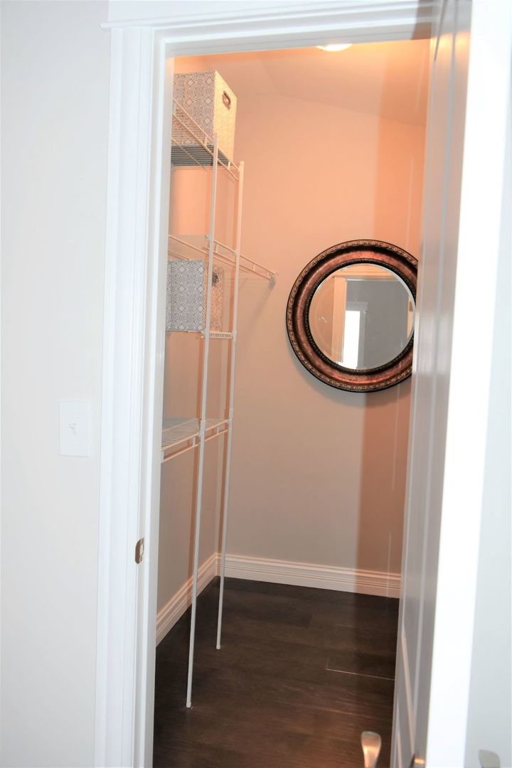 9405 South Laflin Street Chicago, IL 60620 - Photo 19 of 24 a bathroom with a sink and a mirror