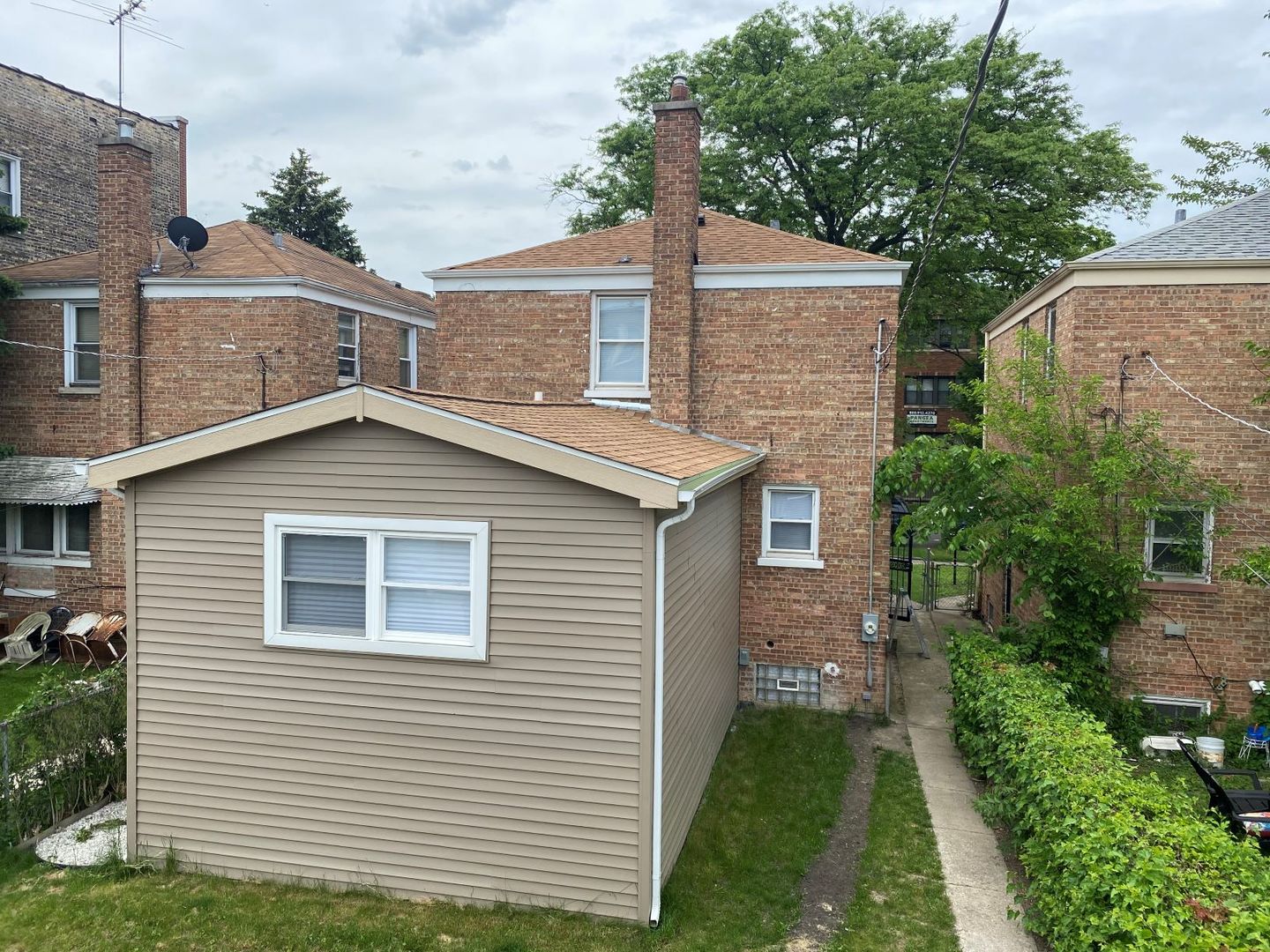 9405 South Laflin Street Chicago, IL 60620 - Photo 23 of 24 a front view of a house with a yard