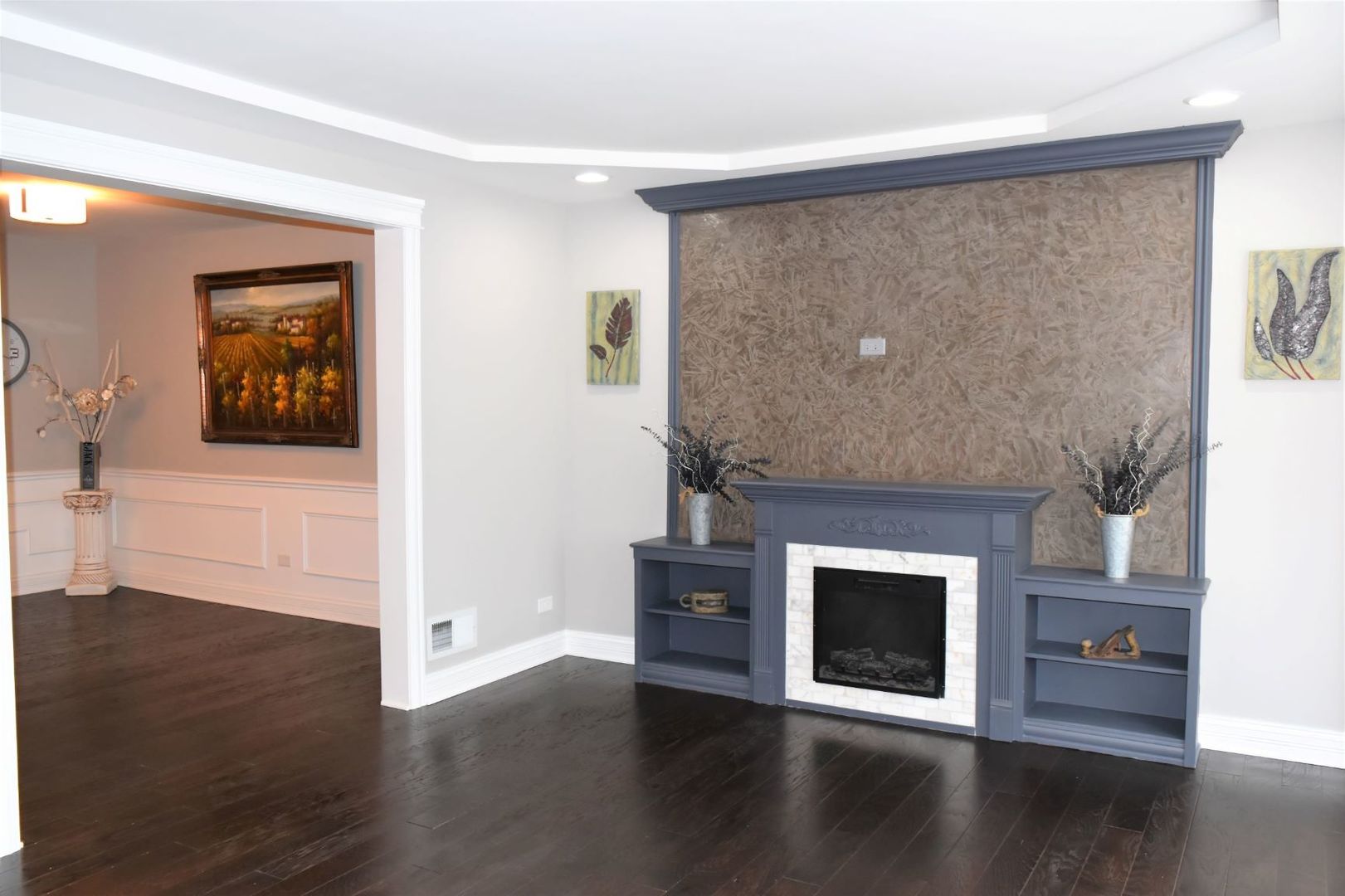 9405 South Laflin Street Chicago, IL 60620 - Photo 4 of 24 a living room with a fireplace and wooden floor