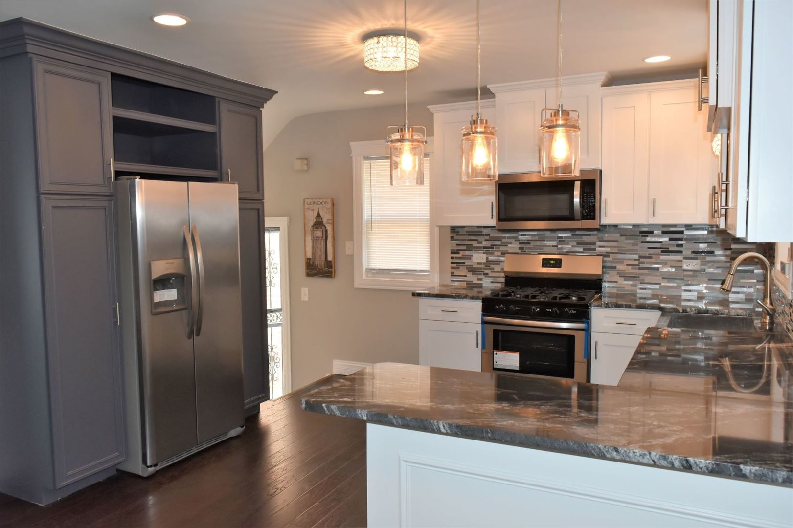 9405 South Laflin Street Chicago, IL 60620 - Photo 7 of 24 a kitchen with stainless steel appliances granite countertop a refrigerator a stove a sink and a oven
