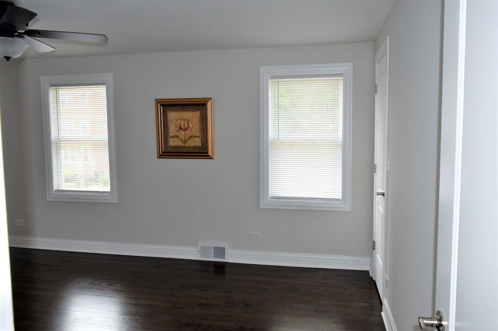 9405 South Laflin Street Chicago, IL 60620 - Photo 10 of 24 a view of an empty room with wooden floor and a window