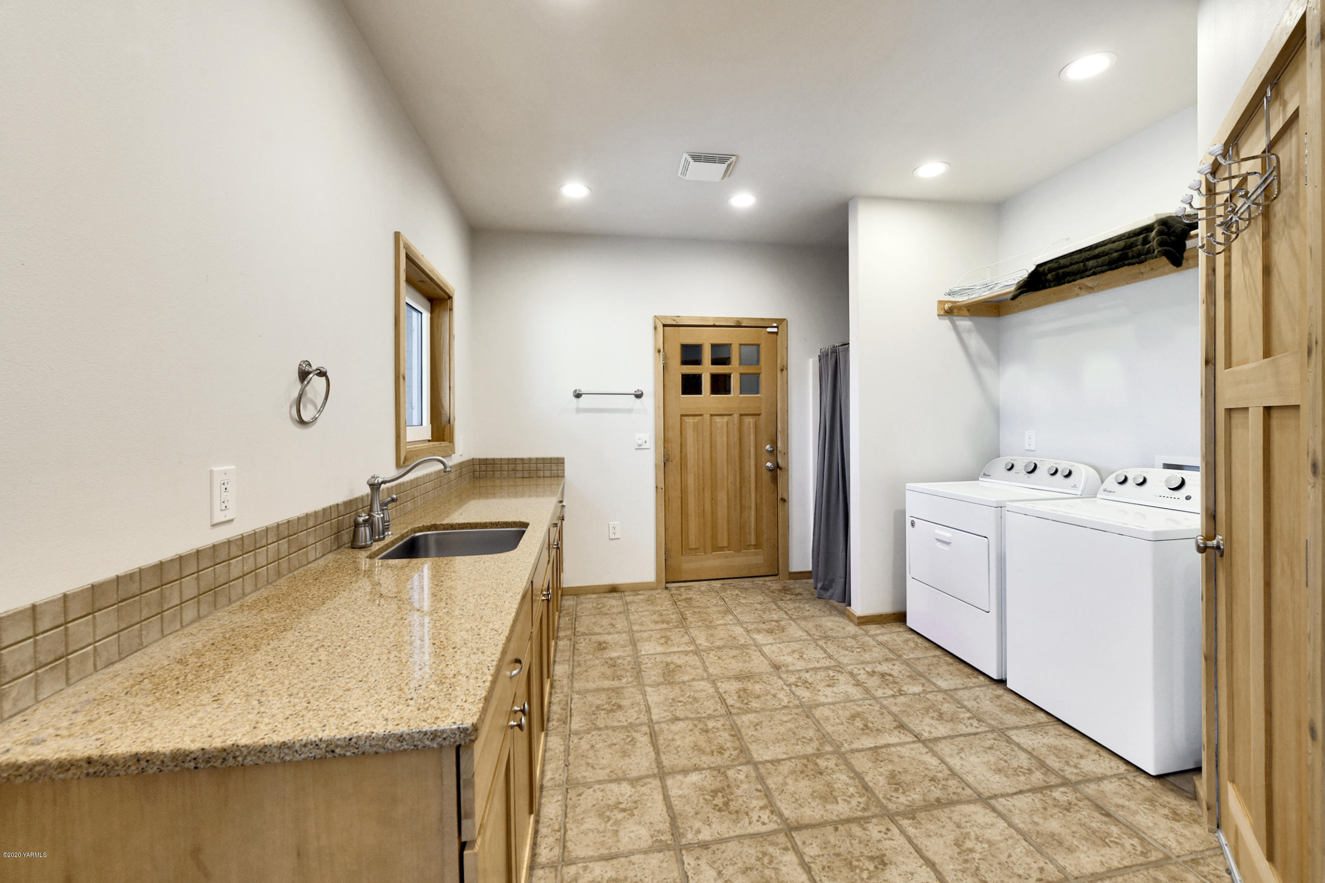 451 Black Hawk Road Yakima, WA 98908 - Photo 13 of 27 a kitchen with a sink stove and refrigerator
