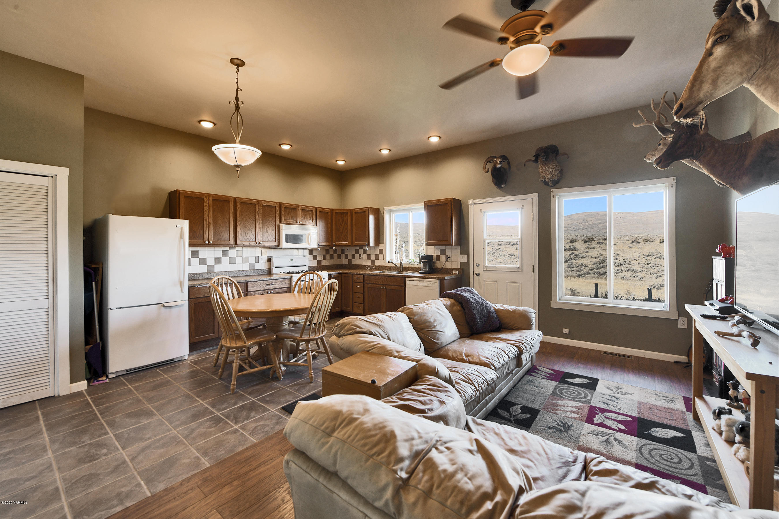 451 Black Hawk Road Yakima, WA 98908 - Photo 18 of 27 a living room with lots of furniture and kitchen view