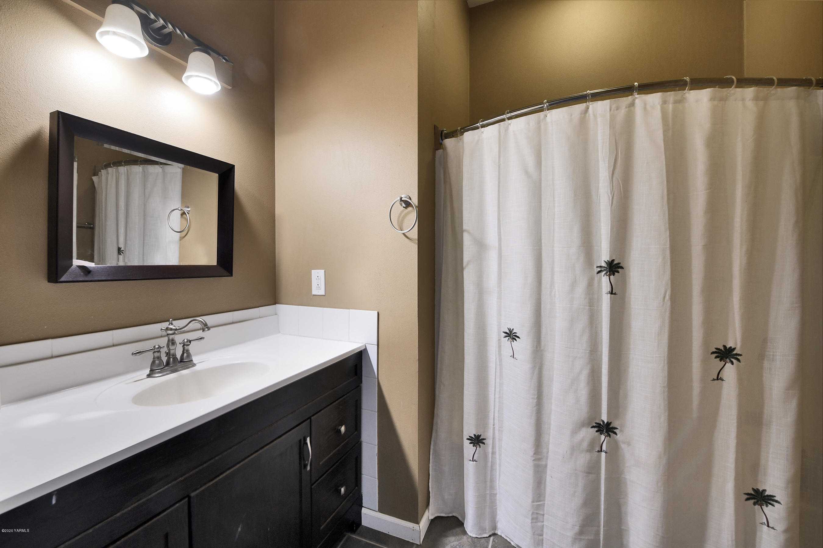 451 Black Hawk Road Yakima, WA 98908 - Photo 20 of 27 a bathroom with a double vanity sink and mirror