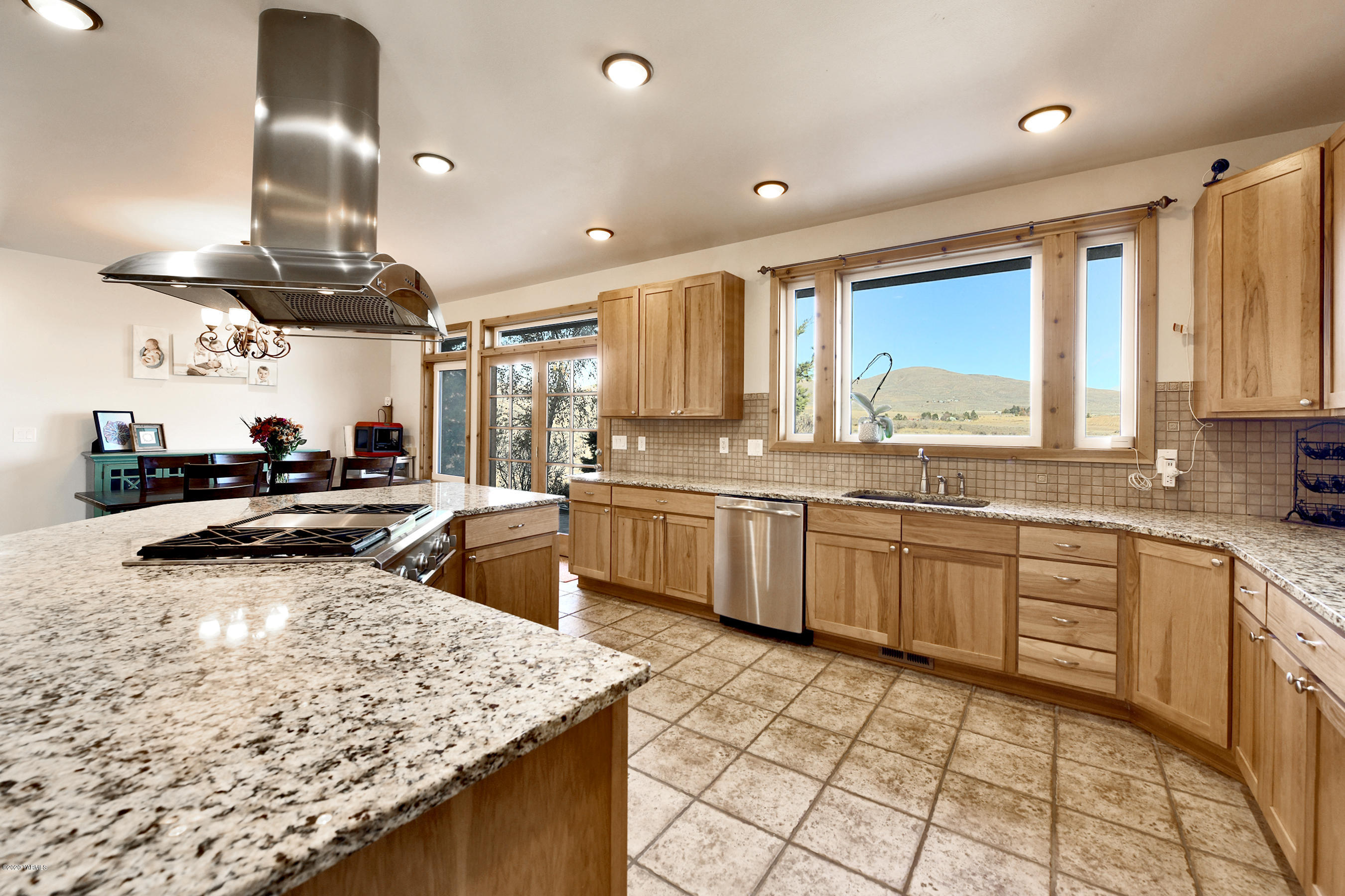 451 Black Hawk Road Yakima, WA 98908 - Photo 6 of 27 a kitchen with stainless steel appliances granite countertop sink stove and refrigerator