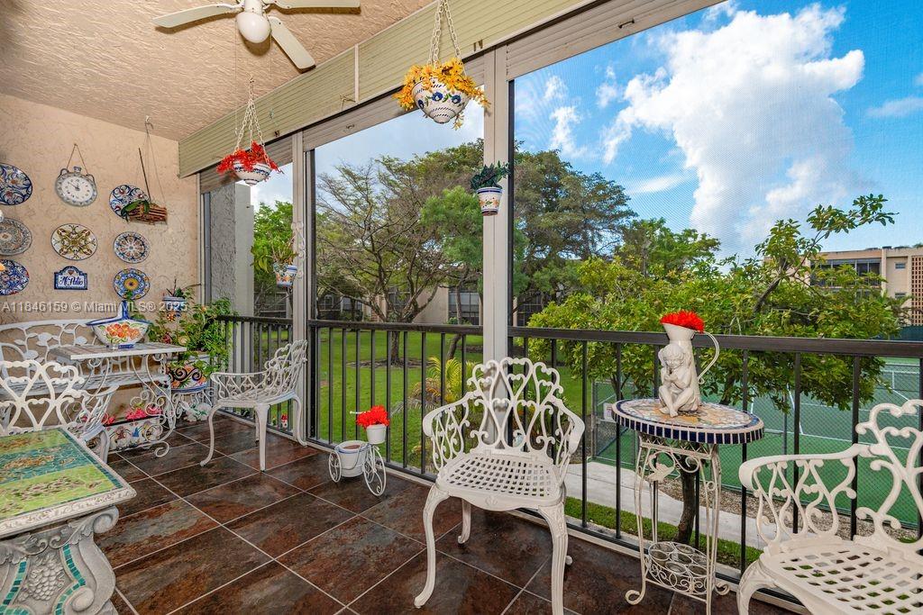 a view of a patio with a table chairs and a table