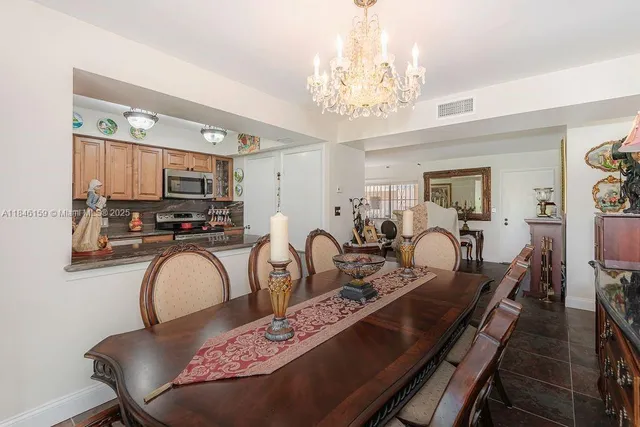 a very nice looking dining room with furniture