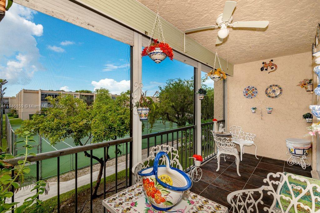 8401 Southwest 107th Avenue, Unit 214E Miami, FL 33173 - Photo 2 of 28 a balcony with lots of potted plants