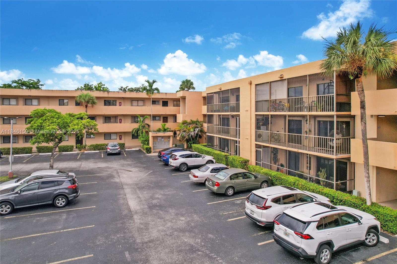 8401 Southwest 107th Avenue, Unit 214E Miami, FL 33173 - Photo 27 of 28 a car parked in front of a building