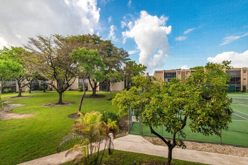 8401 Southwest 107th Avenue, Unit 214E Miami, FL 33173 - Photo 5 of 28 a view of a golf course with a fountain