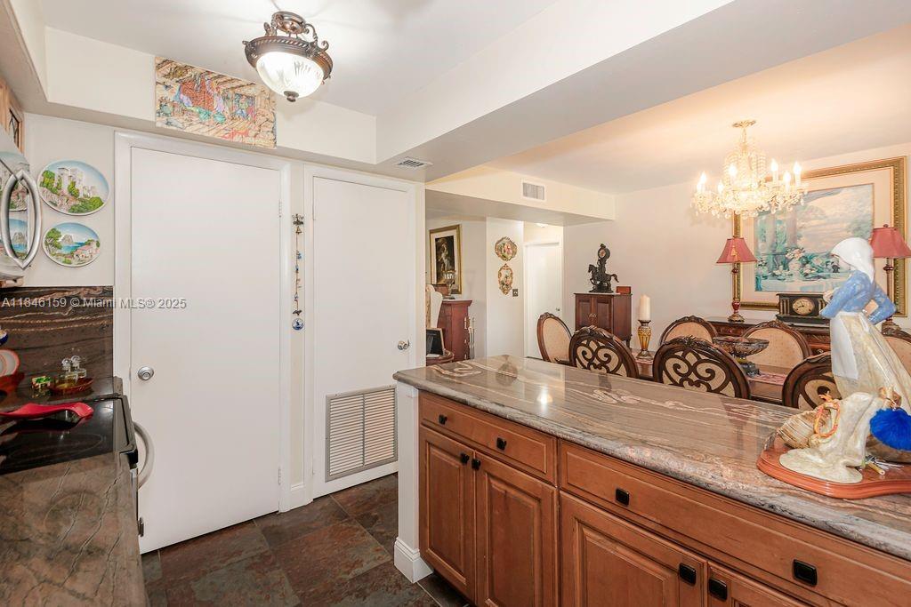8401 Southwest 107th Avenue, Unit 214E Miami, FL 33173 - Photo 7 of 28 a bathroom with a sink mirror and vanity