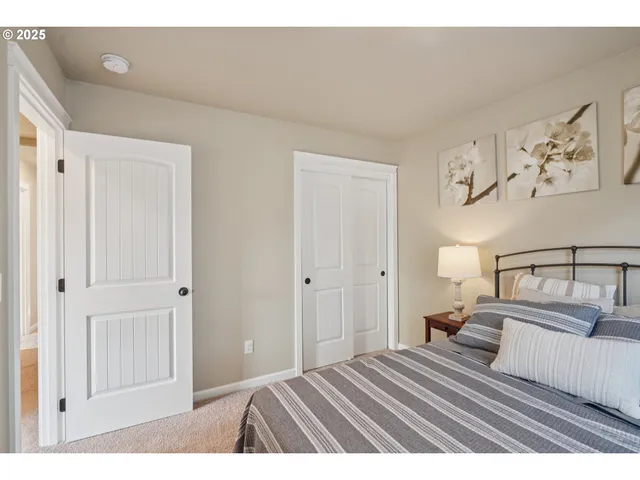 a bedroom with a bed and closet