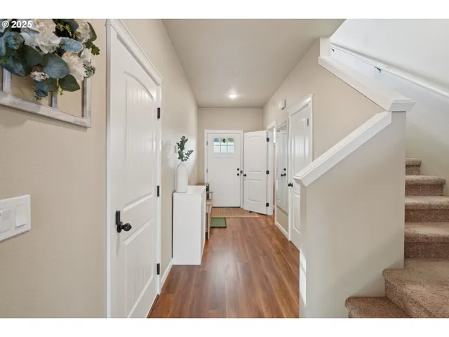 a view of entryway with wooden floor